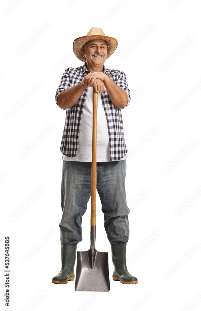 Full length portrait of a mature farmer leaning on a shovel and smiling ...