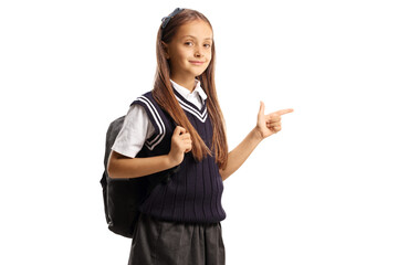 Poster - Schoolgirl with a backpack and a uniform pointing to the side