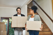 © Allistair/peopleimages.com - Couple homeowners moving in, carrying boxes and unpacking in new purchased home as real estate investors. Smiling, happy and cheerful interracial man and woman, first time buyers and property owners
