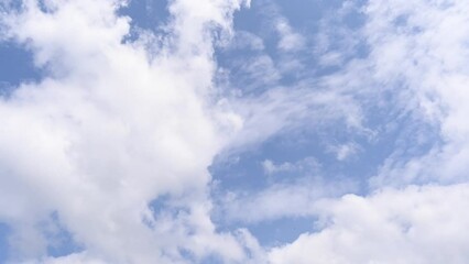 Wall Mural - cloud and blue sky timelape of dramatic fast moving white clouds on sunny blue sky