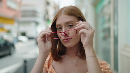 Sticker - Young redhead woman smiling confident wearing glasses at street