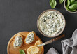 © Taborisova - Spinach appetizer or dip with bread, top view, dark background, copy space