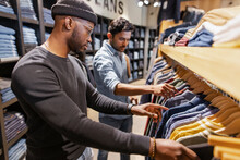 Men Shopping For Shirts In Clothing Store