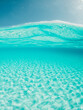 © ishootforthegram - Half underwater shot, clear turquoise water and sunny blue sky. Tropical ocean
