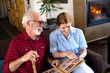 © Solid photos - Senior man with young nurse at home getting home care