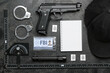 © Pixel-Shot - Notebook with document of FBI agent and accessories on dark background