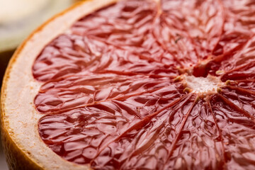 Wall Mural - Close-up view of fresh textured grapefruit halved cross section