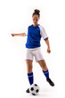 © WavebreakMediaMicro - Full length of biracial young female soccer player kicking soccer ball against white background