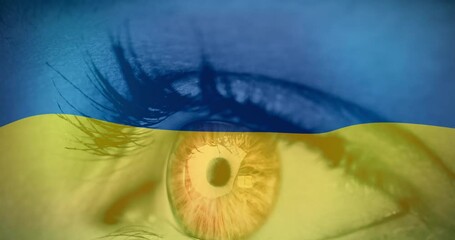 Wall Mural - Animation of flag of ukraine waving over open eye of caucasisan woman