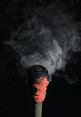 Sticker - smoking torch isolated on black background