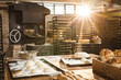 © Wavebreak Media - Interior of bakery with back lit emitting from window