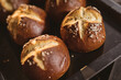 © Wavebreak Media - High angle close-up of cross bun with sesame seed in tray