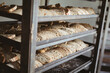 © Wavebreak Media - Close-up of bread slices in tray on rack in bakery