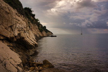 Wall Mural - The coast of Moraira a cloudy day by the sea