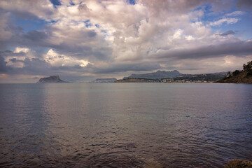 Wall Mural - The coast of Moraira a cloudy day by the sea