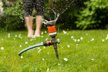Close-up Of Sprinkler On Lawn