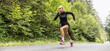Dedicated sprinter runs on an asphalt road outdoors training for better performance