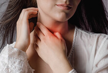 Woman Touches Neck Throat With Hand, Tonsillitis And Sore Throat