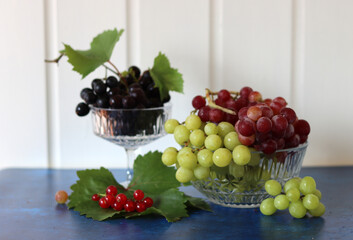 Sticker - Black, green and red grapes on close up.  Top view photo of seasonal fruits. Healthy eating concept. 