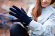 © ADDICTIVE STOCK - Crop female cyclist putting on gloves