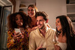 © ADDICTIVE STOCK - Happy young diverse friends spending time together at home