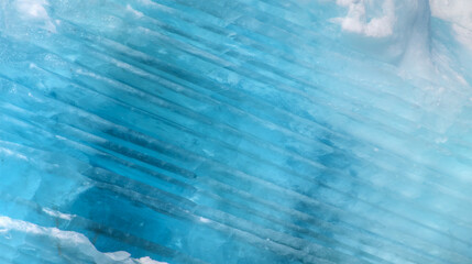 Wall Mural - a close-up of the layered surface of a blue glacier - knud rasmussen glacier near kulusuk - greenlan