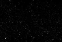 Chaotic White Star Bokeh On A Isolated Black Background. Falling Blurry Bokeh Snow Overlay, Starry Sky. White Spots On Black Background, White Drops And Spots. Abstraction