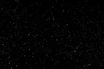 Chaotic white star bokeh on a isolated black background. falling blurry bokeh snow overlay, starry sky. white spots on black background, white drops and spots. abstraction