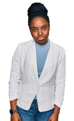 Canvas Print - Young african american woman wearing business clothes depressed and worry for distress, crying angry and afraid. sad expression.