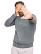 © Krakenimages.com - Handsome middle age man wearing business clothes covering eyes with hands and doing stop gesture with sad and fear expression. embarrassed and negative concept.
