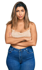 Sticker - Beautiful brunette woman wearing casual clothes skeptic and nervous, disapproving expression on face with crossed arms. negative person.