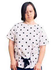 Sticker - Brunette woman with down syndrome wearing casual clothes skeptic and nervous, frowning upset because of problem. negative person.