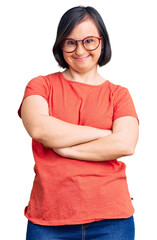 Poster - Brunette woman with down syndrome wearing casual clothes and glasses happy face smiling with crossed arms looking at the camera. positive person.