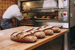 © ADDICTIVE STOCK - Male baker near oven in bakery