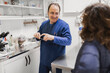 © ADDICTIVE STOCK - Smiling doctor talking with woman in medical room