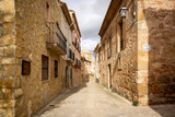 Fototapeta Do przedpokoju - a street with traditional houses in Monteagudo de las Vicarias town, province of Soria, Castile and León, Spain