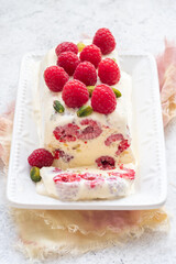 Wall Mural - semifreddo, italian ice cream dessert, with raspberry and pistachios