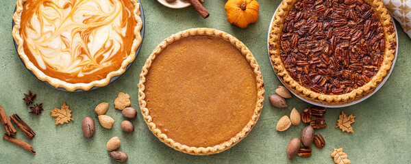 Traditional fall Thanksgiving pies, pumpkin and pecan pie