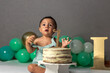 © ADDICTIVE STOCK - Ethnic boy eating cream on birthday cake