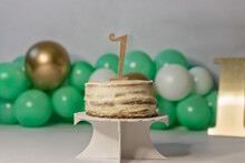 Festive Birthday Cake With Cream Near Balloons