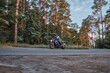 © perfectlab - Blurred Motion A young man biker in a helmet quickly rides at high speed on a forest road, in motion