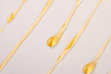 Wall Mural - cannabis wax resin dripping down white paper closeup