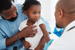 © Nina Lawrenson/peopleimages.com - Father, child in consultation with pediatrician doctor for medical healthcare, insurance and trust. Black people, girl and men consulting appointment in hospital clinic for kid or toddler vaccination