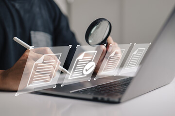 Leinwandbilder - hand using a laptop computer with a virtual screen and document for paperless quality assurance and ERP management concept for online approval.