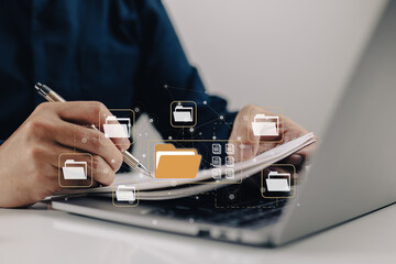 Aufkleber - Electronic-document-based paperless office concept. A businessman types while looking at icons for electronic documents on a virtual screen while using a laptop keyboard.