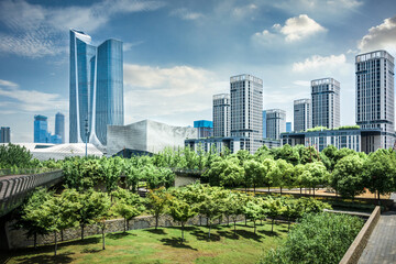 Canvas Print - Buildings and green parks in a modern big city