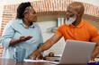 © wavebreak3 - Senior african american couple spending time at home together