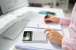 © Andrey Popov - Public Tax Accountant Using Calculator