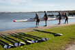 © Wavebreak Media - Senior caucasian rowing team putting the boat in the lake while standing on the wooden dock