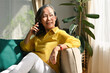 © saltdium - Elegant old woman calling on smartphone at home, Technology, Communication and People concept.